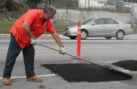 Man repairing street
